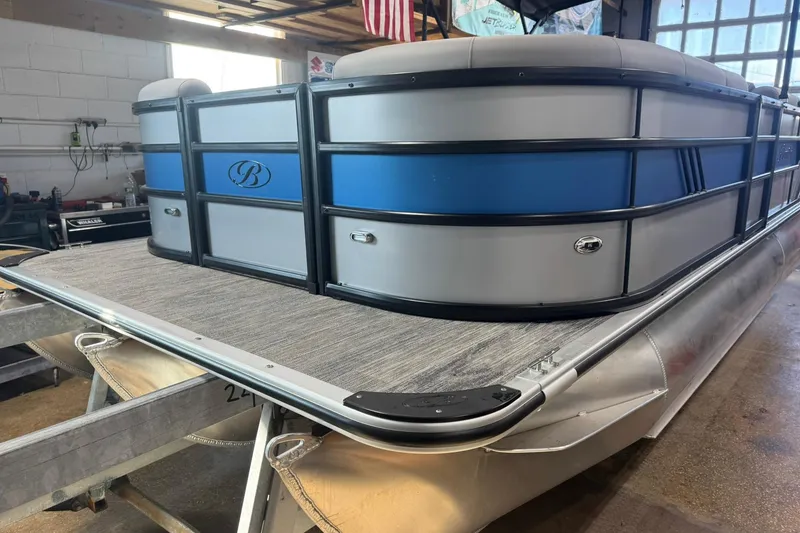 Slide: The Image of 2026 Bentley Pontoons Bolt 223 in a showroom, showcasing sleek design and modern features. - 23