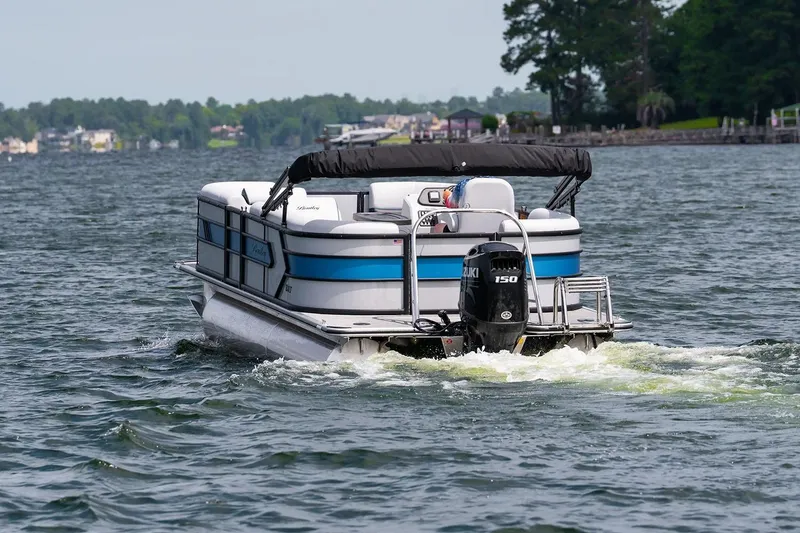 Slide: The Image of 2026 Bentley Pontoons Bolt 223 interior with gray seating and modern dashboard. - 3