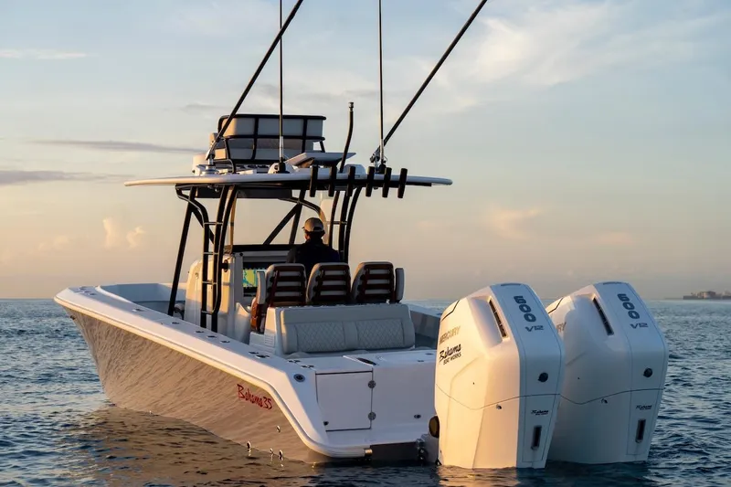 Slide: The Image of 2026 Bahama Boat Works 35 Center Console cruising at sunset with dual Mercury engines. - 11