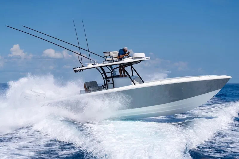 Slide: The Image of 2026 Bahama Boat Works 35 Center Console cruising on open ocean waters. - 13