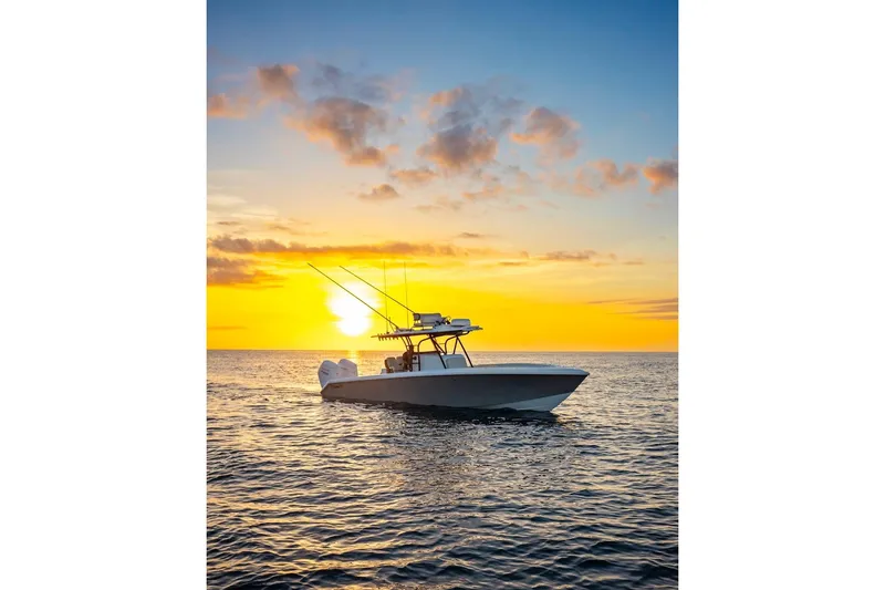 Slide: The Image of 2026 BAHAMA BOAT WORKS 35 Center Console at sunset on the ocean. - 16