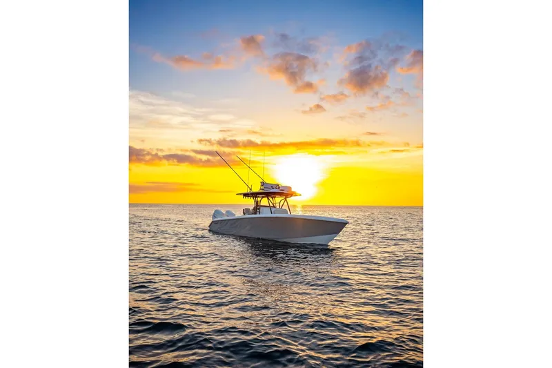 Slide: The Image of 2026 Bahama Boat Works 35 Center Console at sunset on open water. - 19