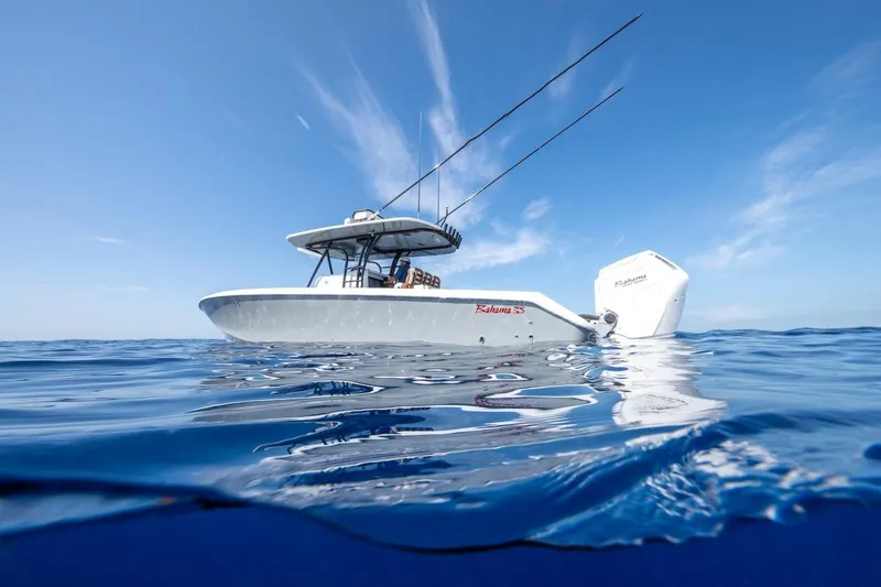 Slide: The Image of 2026 Bahama Boat Works 35 Center Console on open ocean under clear blue sky. - 2