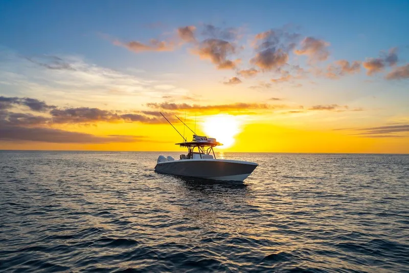 Slide: The Image of 2026 Bahama Boat Works 35 Center Console at sunset on the ocean. - 20