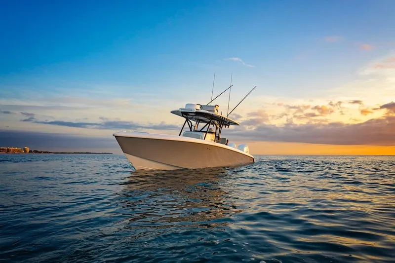 Slide: The Image of 2026 BAHAMA BOAT WORKS 35 Center Console on ocean at sunset. - 21