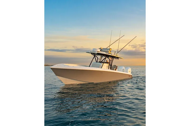 Slide: The Image of 2026 BAHAMA BOAT WORKS 35 Center Console on calm ocean at sunset. - 22