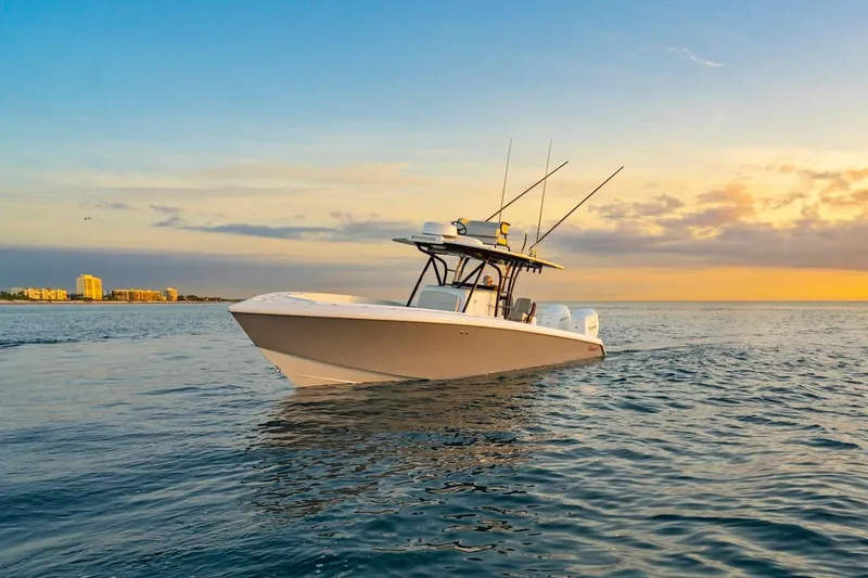 Slide: The Image of 2026 BAHAMA BOAT WORKS 35 Center Console on ocean at sunset. - 23