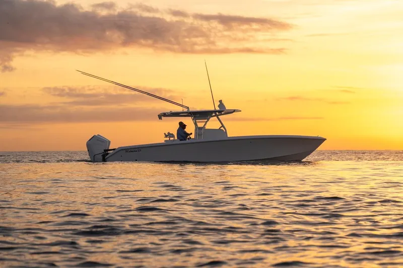 Slide: The Image of 2026 Bahama Boat Works 35 Center Console at sunset on the ocean. - 4