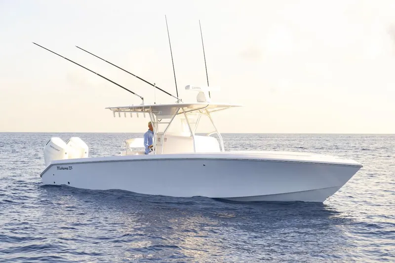 Slide: The Image of 2026 BAHAMA BOAT WORKS 35 Center Console on open water at sunset. - 7