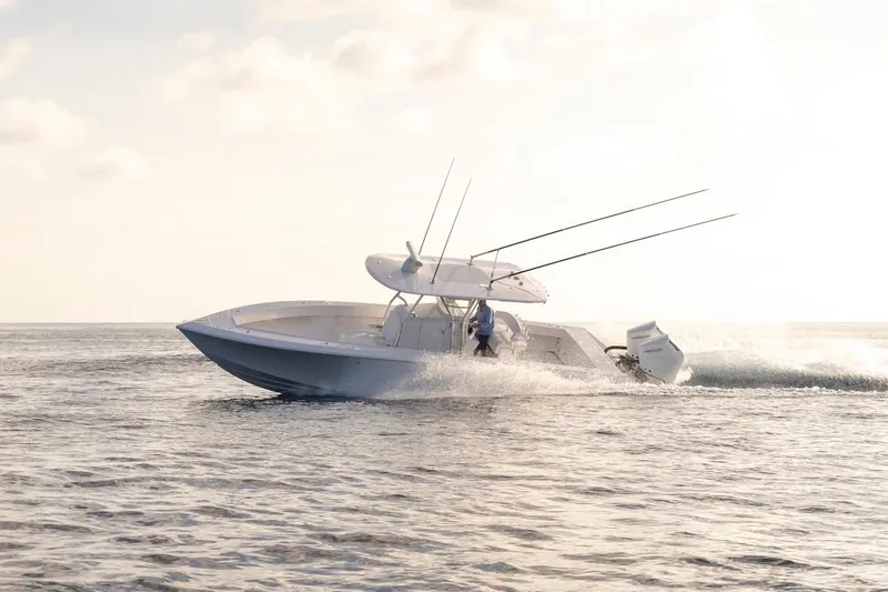 Slide: The Image of 2026 BAHAMA BOAT WORKS 35 Center Console cruising on open water. - 9