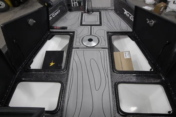Slide: The Image of 2026 Yar-Craft 210 TFX boat interior with storage compartments and sleek design. - 10