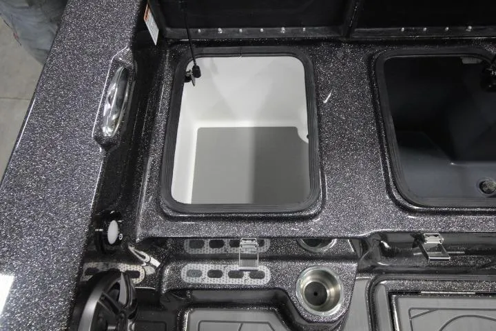 Slide: The Image of 2026 Yar-Craft 210 TFX boat interior with storage compartments and cup holders. - 13