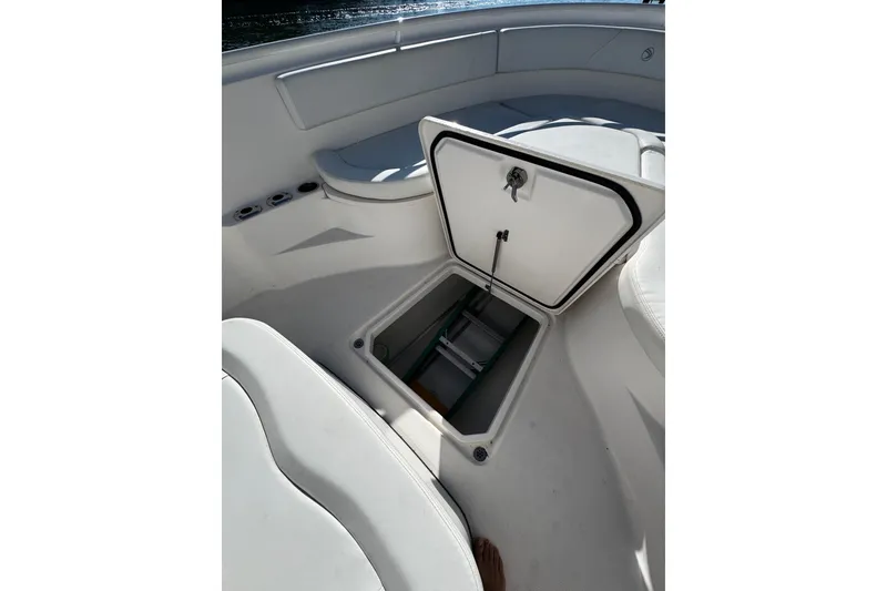 Slide: The Image of Open storage compartment on 2015 Edgewater 320CC boat deck. - 28