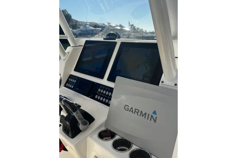 Slide: The Image of Edgewater 320CC 2015 boat dashboard with Garmin navigation system. - 6