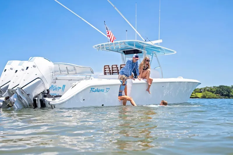 Slide: The Image of 2026 Bahama 37 Center Console boat with people enjoying water activities. - 10