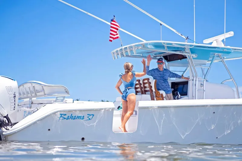 Slide: The Image of 2026 Bahama 37 Center Console boat with people enjoying a sunny day. - 13