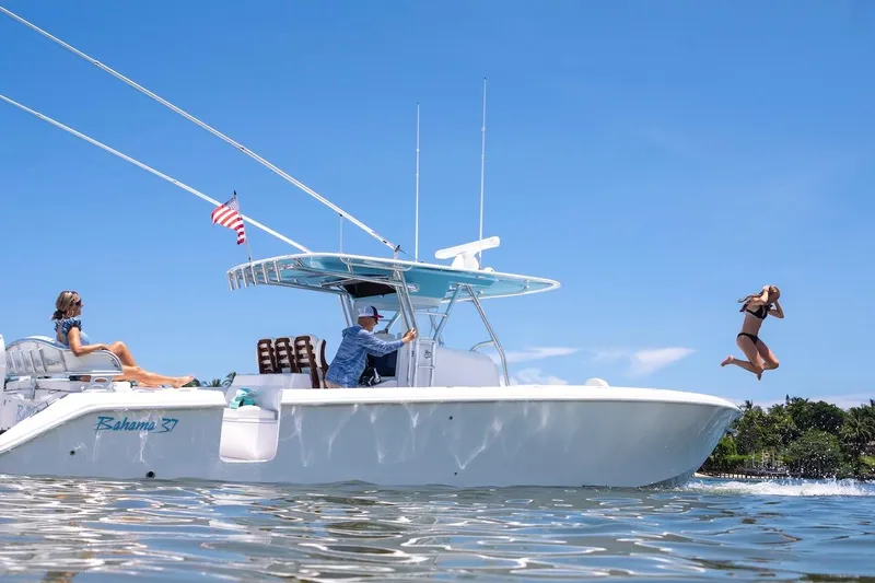 Slide: The Image of 2026 Bahama 37 Center Console boat with people enjoying a sunny day on the water. - 16