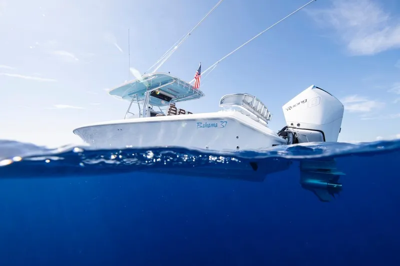 Slide: The Image of 2026 Bahama 37 Center Console boat on clear blue ocean water. - 2
