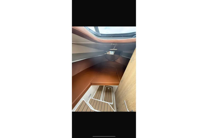 Slide: The Image of Interior cabin of 2024 NX Boats NX270, featuring sleek design and modern finishes. - 8