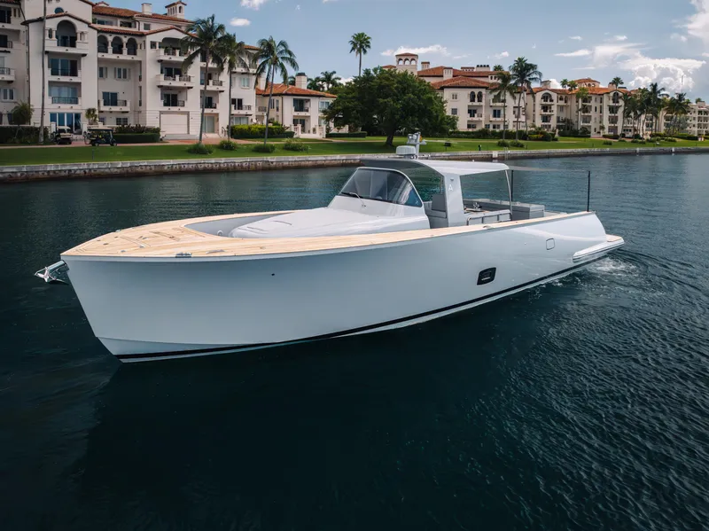 Slide: The Image of Luxury Alen 55 yacht cruising near waterfront residences, 2021 model. - 10