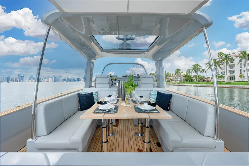 Slide: The Image of Luxury Alen 55 yacht interior with elegant dining setup, 2021 model, ocean view. - 13