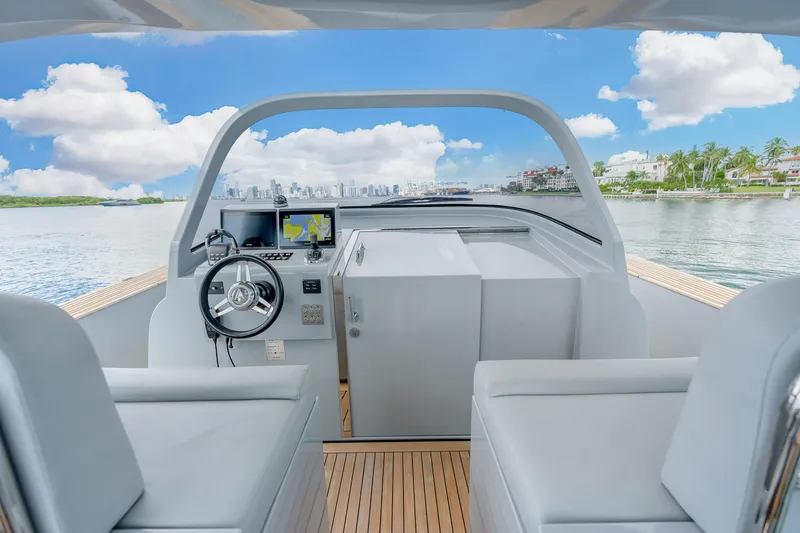 Slide: The Image of Cockpit view of 2021 Alen 55 yacht with modern steering and navigation system. - 16