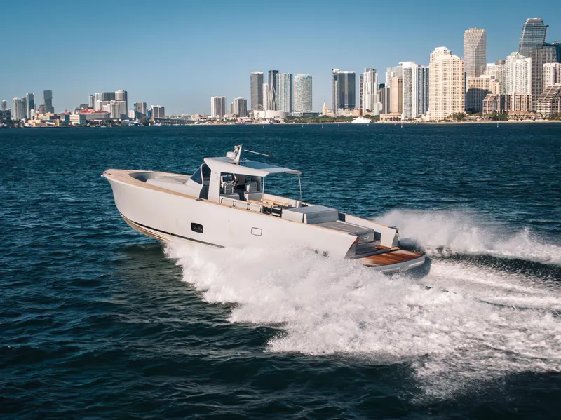 Slide: The Image of 2021 Alen 55 yacht cruising near city skyline on a sunny day. - 25