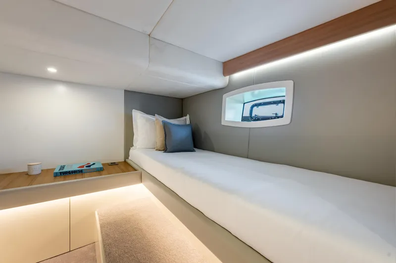 Slide: The Image of Modern cabin interior of 2021 Alen 55 yacht with single bed and window. - 26