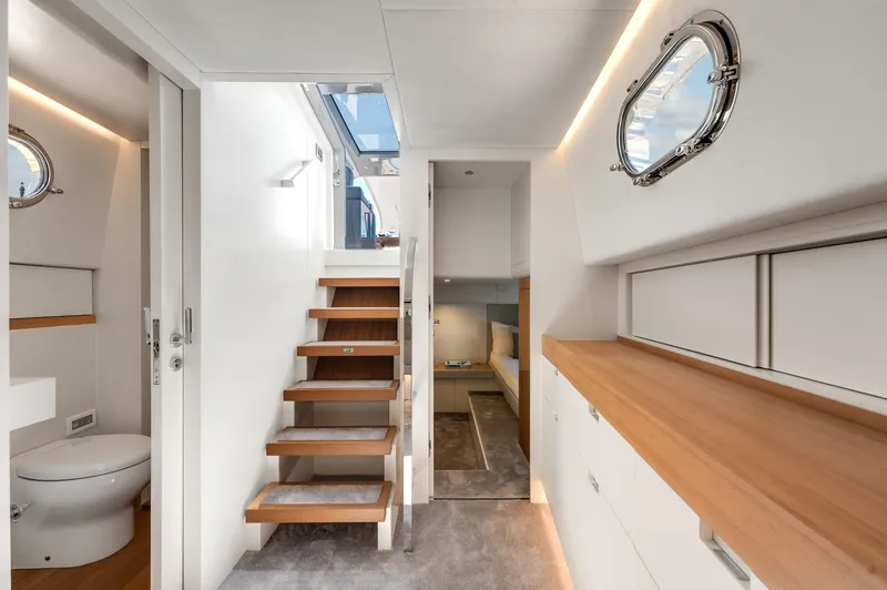 Slide: The Image of Interior of 2021 Alen 55 yacht, featuring modern design, wooden accents, and natural lighting. - 33