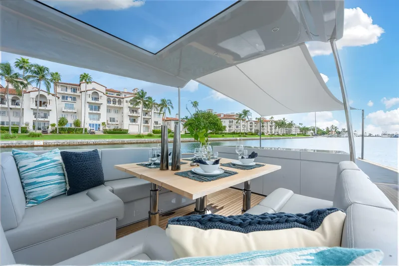 Slide: The Image of Luxurious Alen 55 yacht interior with elegant dining setup, 2021 model, waterfront view. - 34