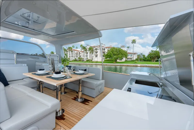 Slide: The Image of Luxurious 2021 Alen 55 yacht interior with elegant dining setup and scenic waterfront view. - 46