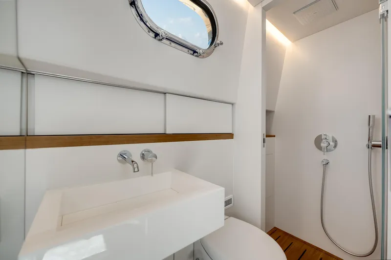 Slide: The Image of Modern bathroom interior in 2021 Alen 55 yacht, featuring sleek sink and shower design. - 48