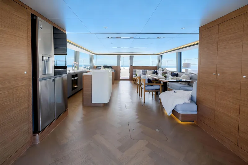 Slide: The Image of Luxurious interior of 2026 Oceanwalker S60 yacht with modern kitchen and dining area. - 14