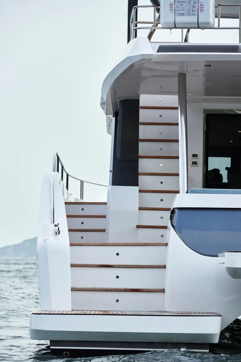 Slide: The Image of Luxury Skywalker S60 yacht, 2025 model, featuring elegant exterior staircase design. - 5