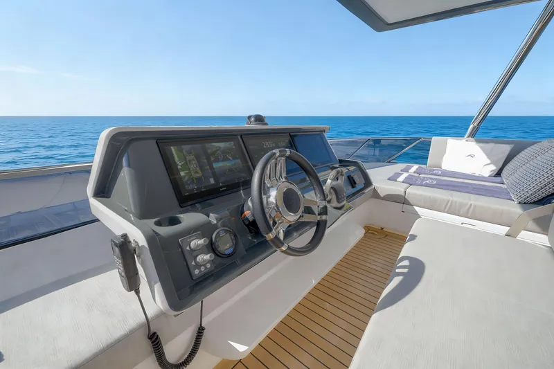 Slide: The Image of Helm of 2026 Oceanwalker S60 yacht with ocean view and modern controls. - 9