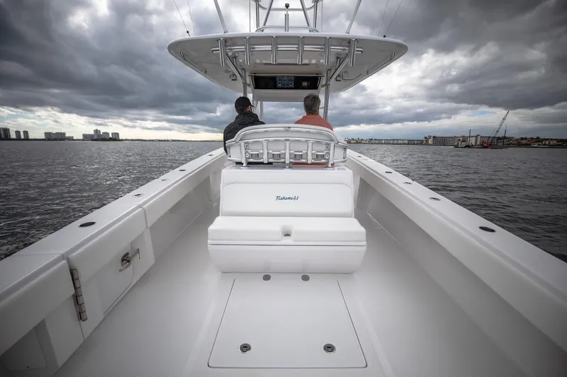 Slide: The Image of 2026 Bahama 41 Center Console boat on water under cloudy sky. - 12