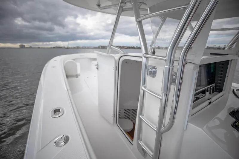 Slide: The Image of 2026 Bahama 41 Center Console boat on water under cloudy sky. - 15
