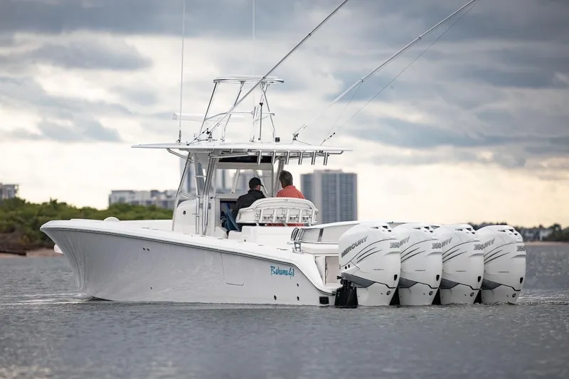 Slide: The Image of 2026 Bahama 41 Center Console boat with multiple outboard engines on the water. - 16