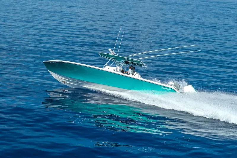 Slide: The Image of 2026 Bahama 41 Center Console boat cruising on open blue water. - 2