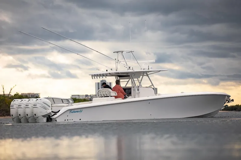 Slide: The Image of 2026 Bahama 41 Center Console boat on water under cloudy sky. - 25