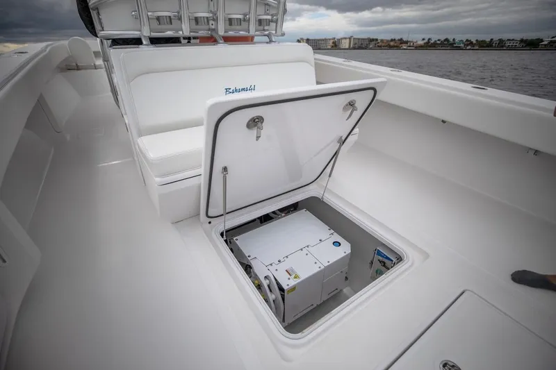Slide: The Image of 2026 Bahama 41 Center Console boat with open storage compartment on deck. - 27