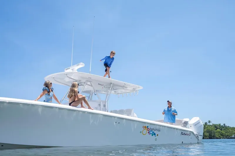 Slide: The Image of 2026 Bahama 41 Center Console boat with people enjoying a sunny day on the water. - 29
