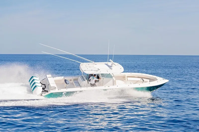 Slide: The Image of 2026 Bahama 41 Center Console boat cruising on open blue ocean waters. - 8