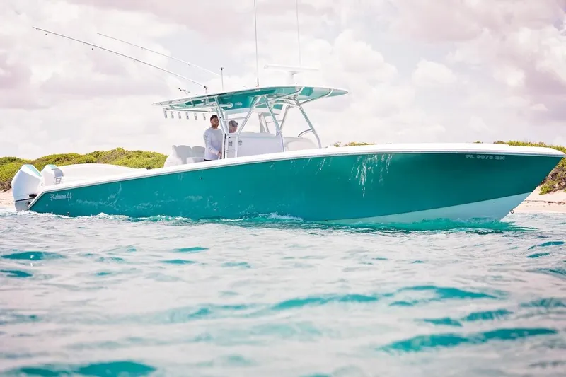 Slide: The Image of 2026 Bahama 41 Center Console boat on clear blue water, sunny day. - 9