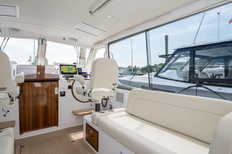 Slide: The Image of Interior of 2025 MJM 35 yacht with helm, seating, and navigation equipment. - 21