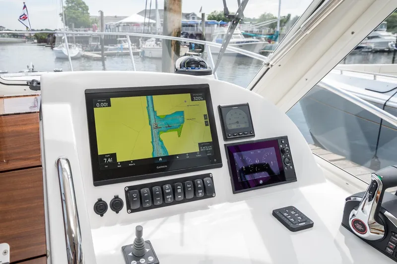 Slide: The Image of Helm of 2025 MJM 35 boat with advanced navigation displays and controls. - 23