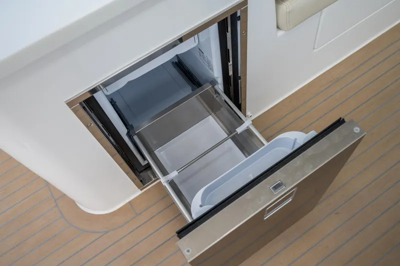 Slide: The Image of Open drawer refrigerator on 2025 MJM 35 boat, showcasing modern design and functionality. - 28
