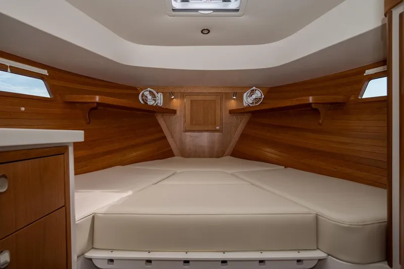 Slide: The Image of Luxurious cabin interior of 2025 MJM 35 yacht with wooden finish and comfortable bedding. - 30