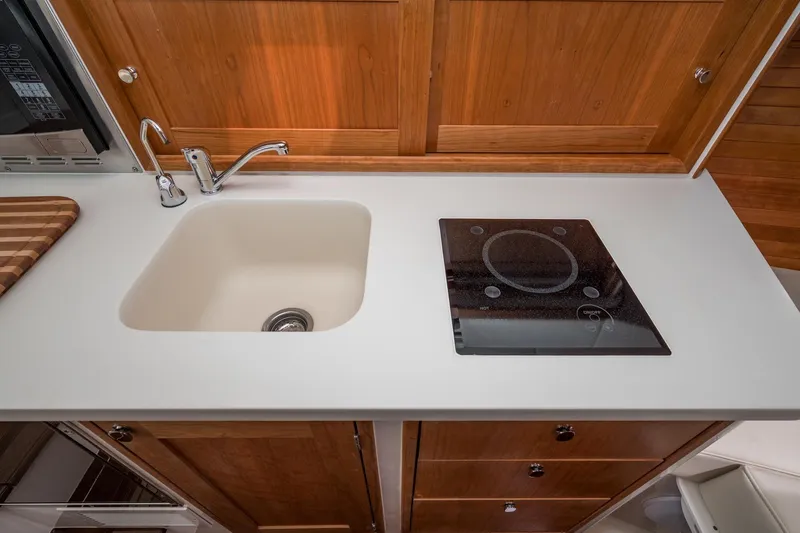 Slide: The Image of Modern kitchen in 2025 MJM 35 boat with sink and induction cooktop. - 32