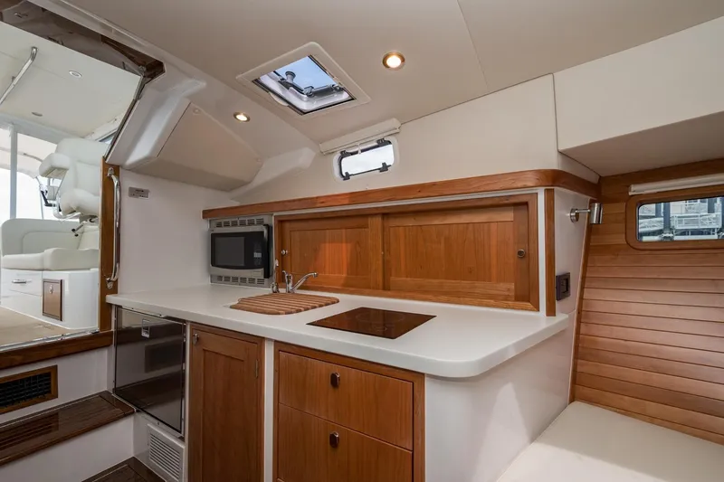 Slide: The Image of Modern kitchen interior of 2025 MJM 35 yacht with wood accents and appliances. - 33